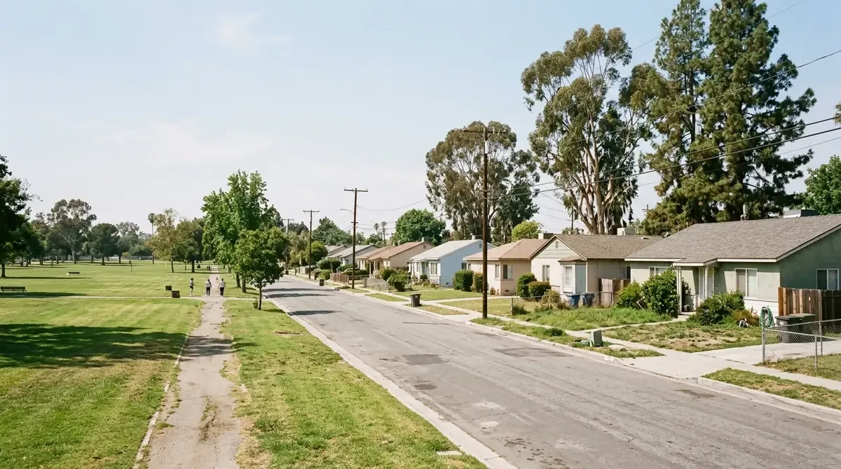 Suburban homes bordering a large park with tall pines near El Dorado Park - Drain services in Bixby Knolls